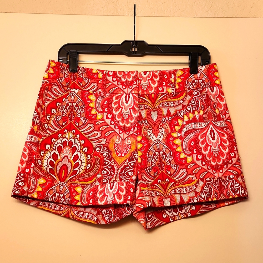 Shorts in orange and yellow multi-patterned design.